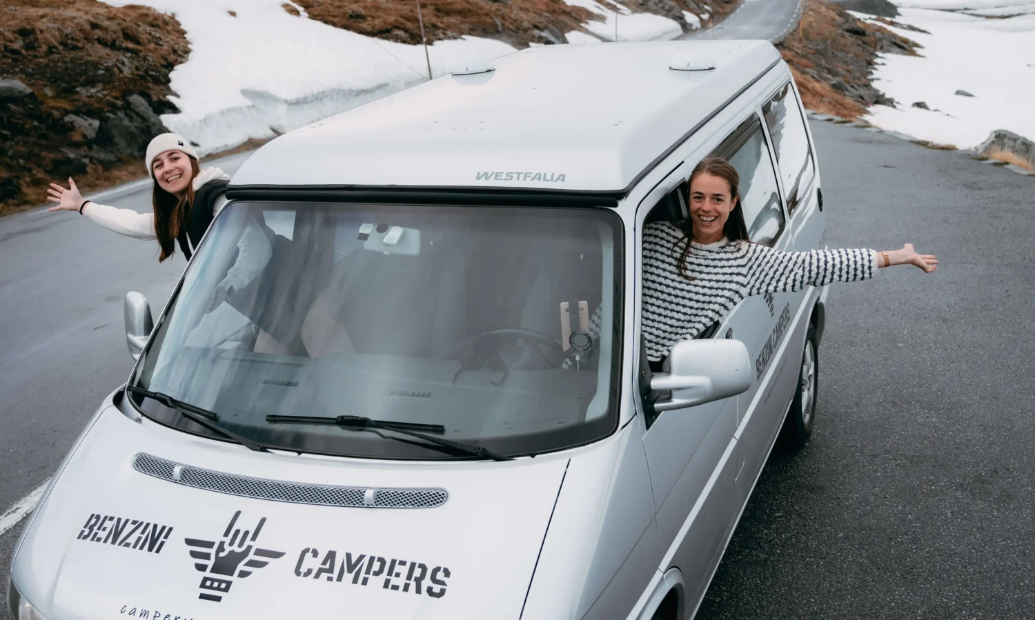 happy girls in campervan in Norway, Sognefjellet